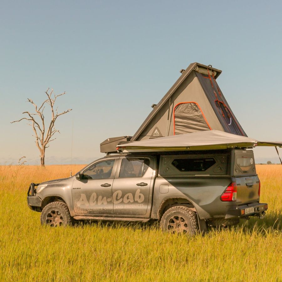Alu-Cab canopy and rooftop tent on a Hilux in the savanna